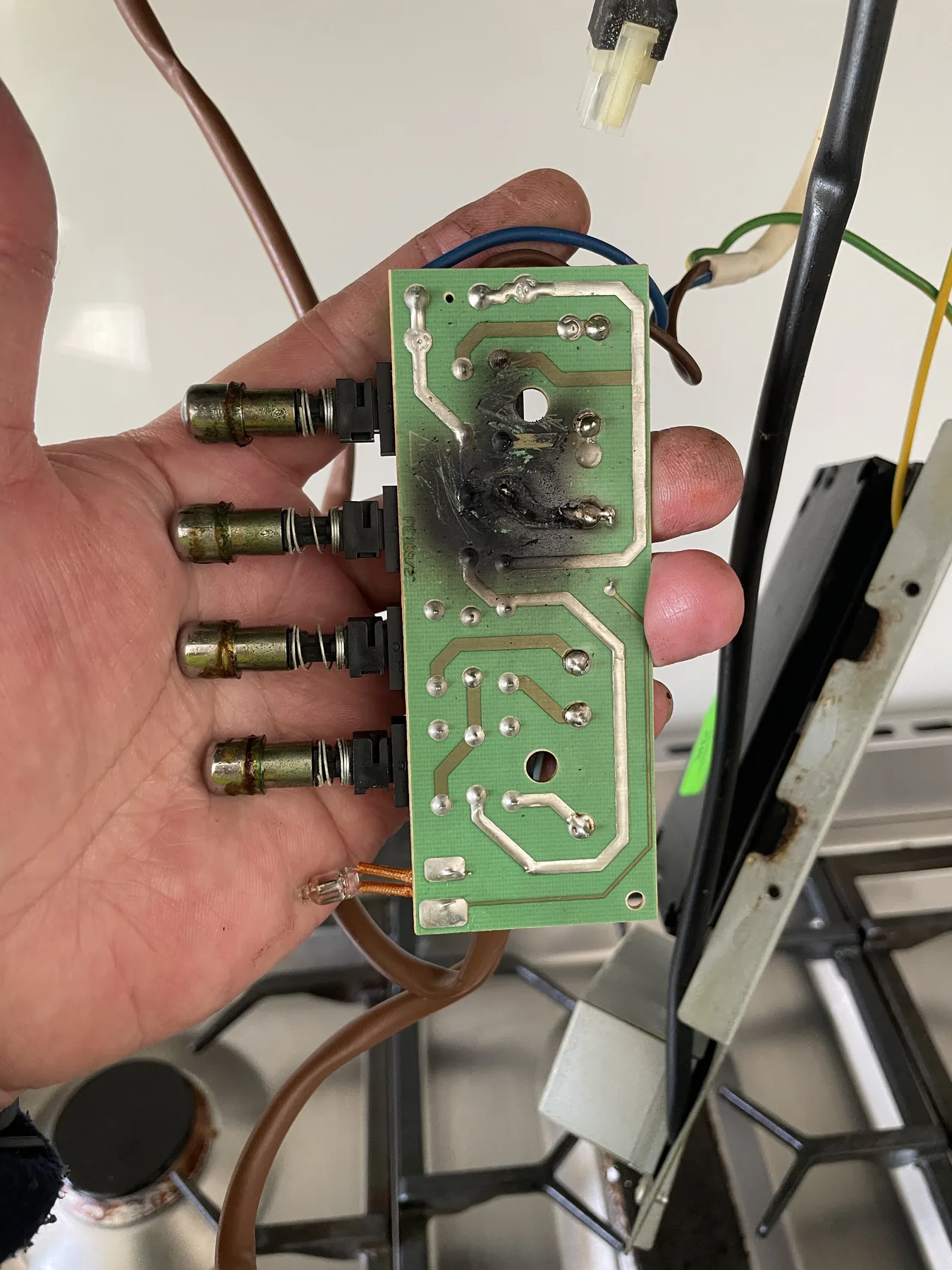 Electronic control board with a visibly heat-affected component area
