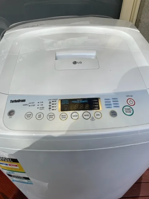 Washing machine control panel showing an operating display